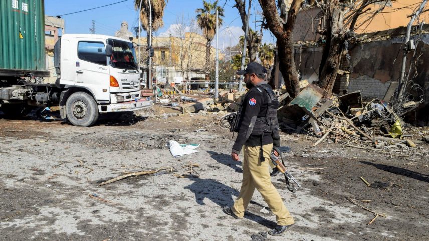 A police officer walks past damage at the site, after militant attacks, in Quetta, Pakistan, February 1, 2026. REUTERS/Stringer/File Photo