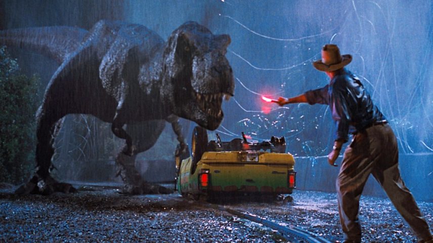 Múltiplas trilhas sonoras dos filmes 'Jurassic Park' e o tema icônico do filme original têm história nas paradas da Billboard. (Foto: Reprodução)