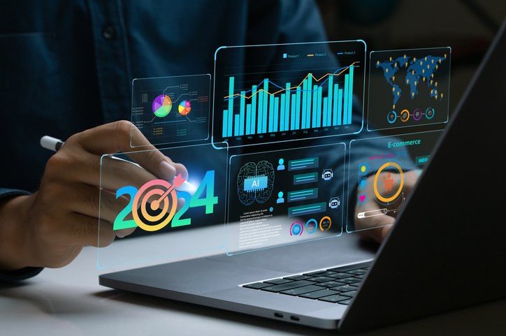 Empresário trabalha em laptop mostrando o painel de tendências de negócios de 2024 com gráficos, métricas, IA, e-commerce e KPI. Profissional analítico planejando o crescimento dos negócios em 2024. Futuro da tecnologia empresarial no Ano Novo. (Foto: pcess609/Getty Images)