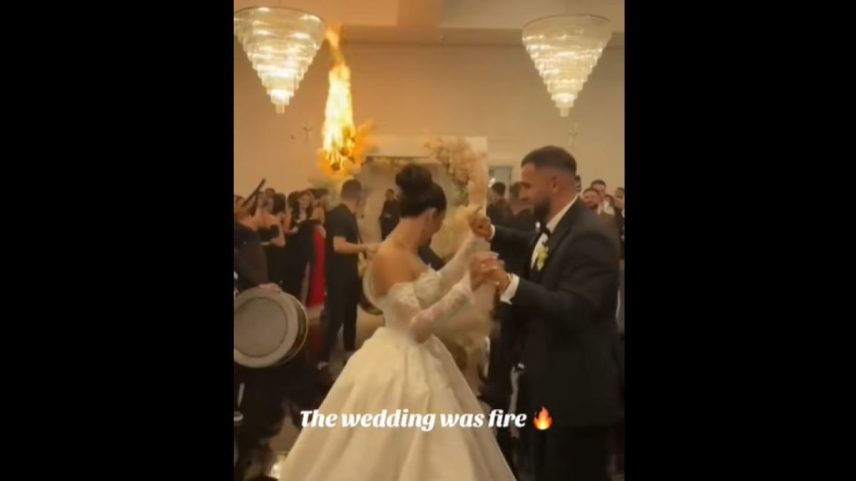 Em vídeo, é possível ver o momento em que os noivos dançam ao som de um grupo de percussão e não percebem o fogo (Foto: Reprodução)