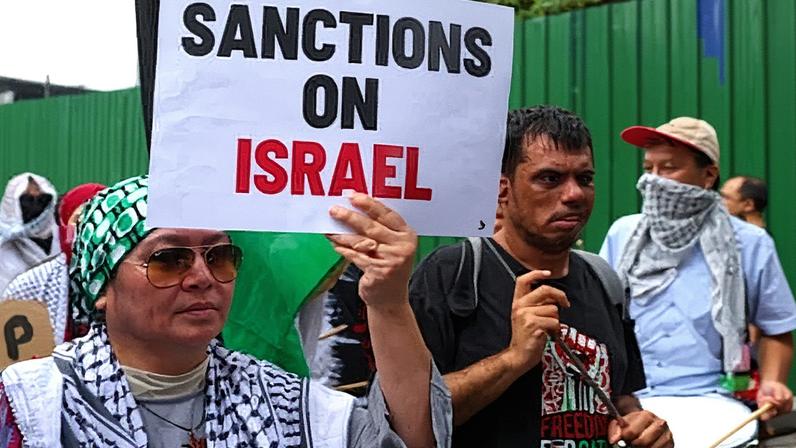 Protesters outside the US embassy in Kuala Lumpur, as Malaysia’s foreign minister told the Hague Group that states should identity companies enabling Israel’s occupation of Palestinian land. Photograph: Fazry Ismail/EPA