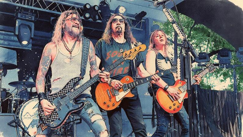 Ryan Cook (left) and Jeremy Asbrock perform with Ace Frehley in 2023.