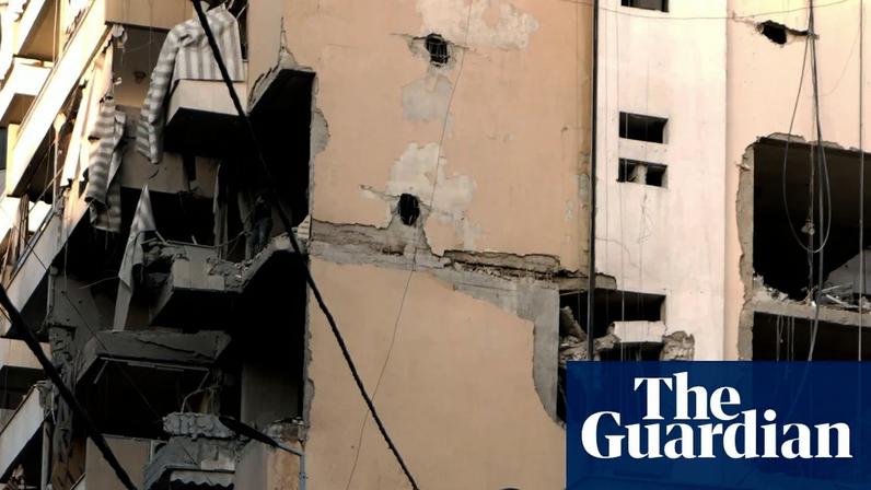 Workers inspect the damage after an apartment building was hit by an Israeli airstrike on the Dahieh area of southern Beirut. Photograph: Bilal Hussein/AP