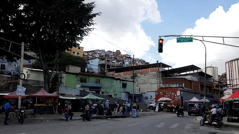 People shop at a popular street market, amid rising tensions between the Trump administration and Nicolás Maduro's government, in Caracas, Venezuela, on 23 November. Photograph: Leonardo Fernández Viloria/Reuters