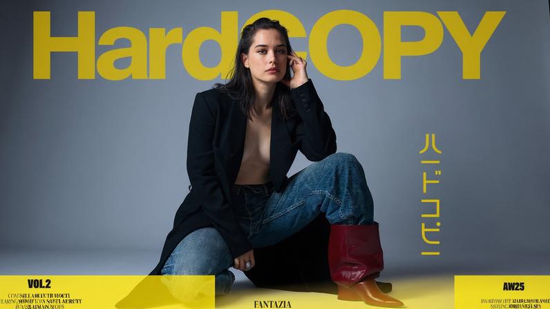Ella Bleu covers HardCopy Magazine’s “Fantazia” issue in an overcoat and designer denim. HardCopy Magazine