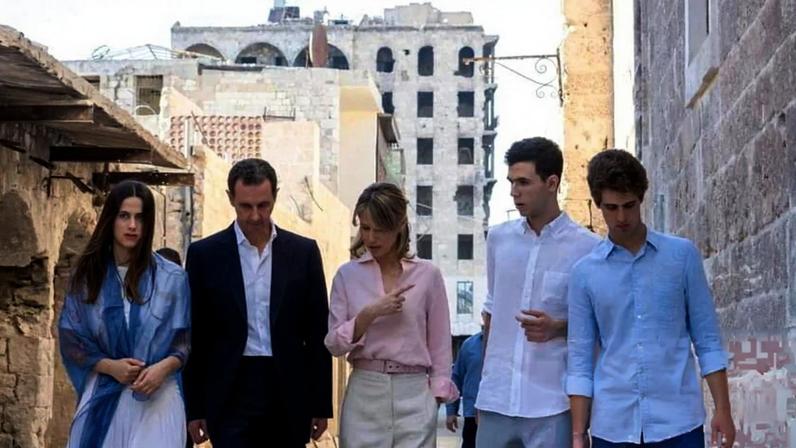 Bashar al-Assad with his wife, Asma, walking with their children in the northern Syrian city of Aleppo in 2022. Photograph: Former Syrian presidency Facebook page/AFP/Getty Images