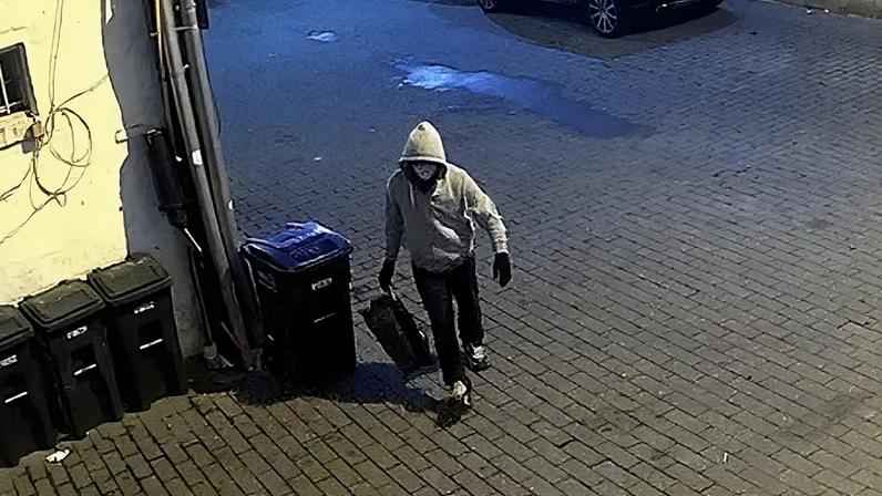 Surveillance photo shows the person who allegedly planted pipe bombs near the RNC and DNC headquarters in Washington DC on 5 January 2021.
