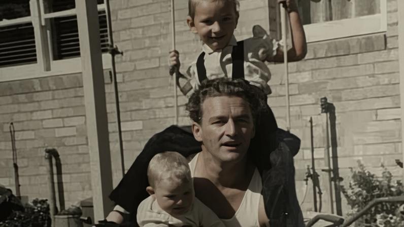 1960. Debra Oswald's father, Max Oswald, her then four-year-old sister Karen Oswald, and Debra as a baby on his lap.