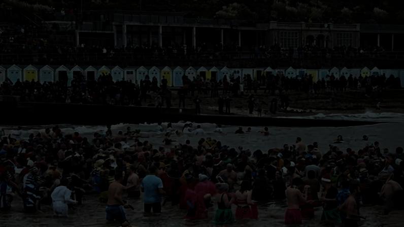 The Lyme Lunge charity swim on 1 January 2023 at Lyme Regis, Dorset.