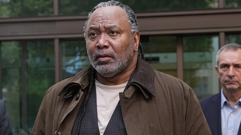 Reginald D Hunter leaving court