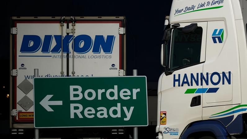 HM Customs signs direct lorry drivers to the correct lane for administration and load checks before boarding ferries in Holyhead, Wales.