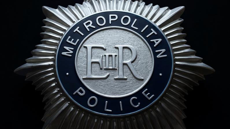 Metropolitan police badge Photograph: Andy Rain/EPA