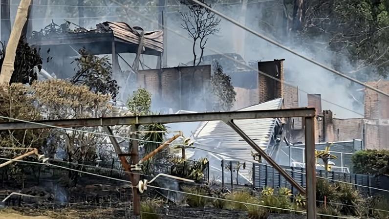Fire-ravaged homes in Central Coast, New South Wales. Temperatures in parts of Australia have topped 40C in recent days.