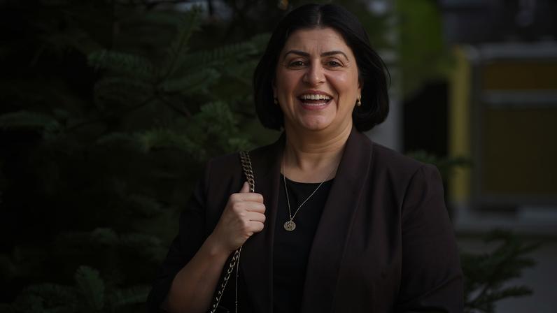 Shabana Mahmood passes a Christmas tree on the way into the BBC's Broadcasting House