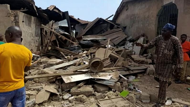 Residents inspect damage after a US strike against IS militants in Offa, Kwara state, Nigeria, on Friday.