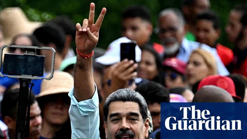 The Venezuelan president, Nicolas Maduro, greets supporters at a rally in Caracas on Wednesday. Photograph: AFP/Getty Images
