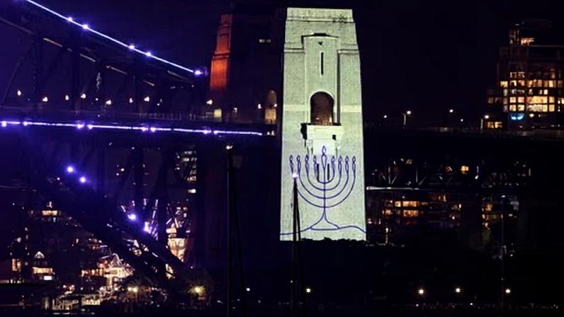 A menorah projected on to Sydney Harbour Bridge on New Year’s Eve in tribute to the victims of the Bondi terror attack.