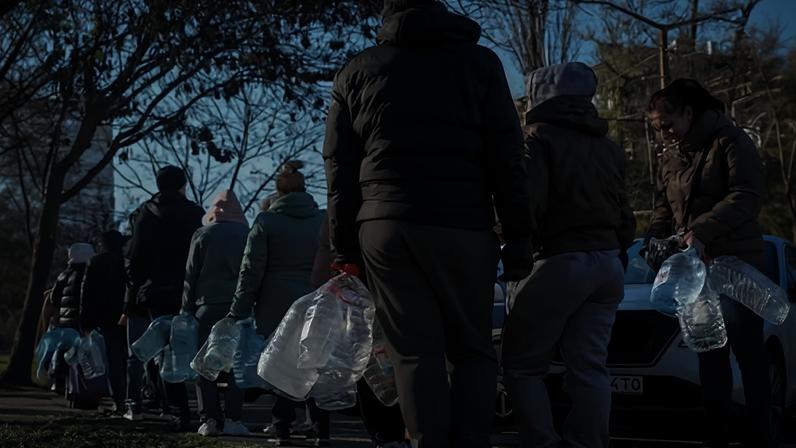 Residents stand in line to fill up bottles with fresh drinking water after critical civil infrastructure was hit by Russian missile and drone attack in Odesa, Ukraine, said Ukrainian authorities.
