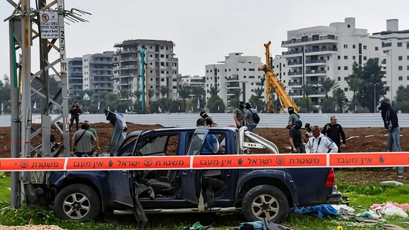 Israeli security forces inspect the scene where a vehicle was used by an assailant in a suspected car-ramming and stabbing attack that killed two people in in Afula, Israel, 26 December 2025.
