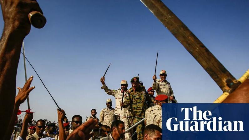 Mohamed Hamdan Daglo, centre right, also known as Hemedti, rides in the back of a vehicle surrounded by RSF members in the village of Qarri, about 90km north of Khartoum, in June 2019. Photograph: Ashraf Shazly/AFP/Getty