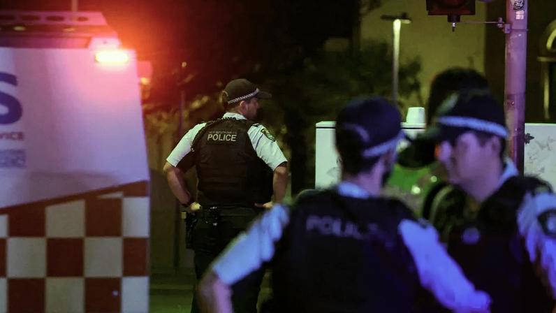 Police after the Bondi beach terror attack. At least 12 people have died, including one alleged gunman. Photograph: David Gray/AFP/Getty Images