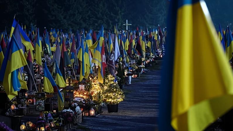 Graves of fallen Ukrainian soldiers decorated with Christmas trees and new year decorations at the Lychakiv military cemetery on the day before Christmas Eve in Lviv, Ukraine.