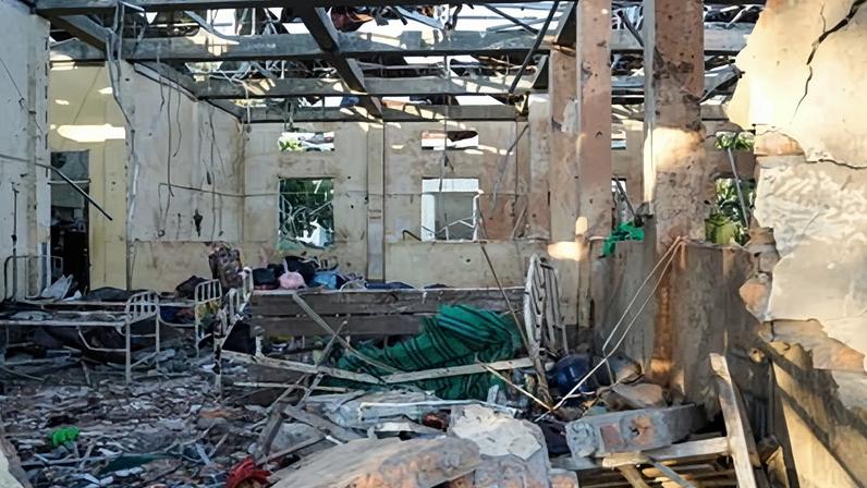 This picture shows a hospital damaged in a Myanmar military air strike that is believed to have killed more than 30 people at a hospital in Mrauk U, western Rakhine state on 11 December, 2025.