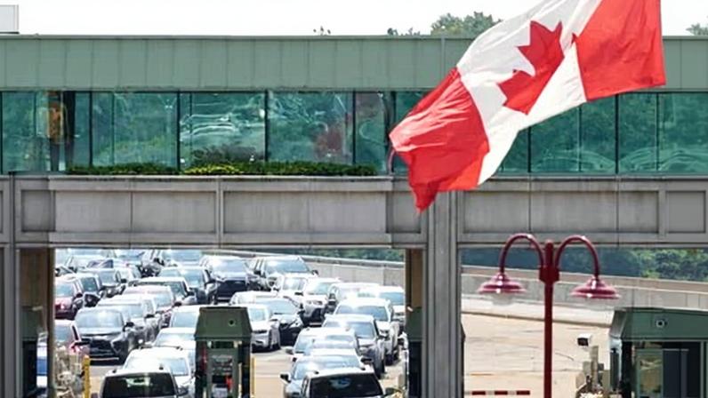 Cars wait to cross into Canada at the Rainbow Bridge in Niagara Falls, Ontario.