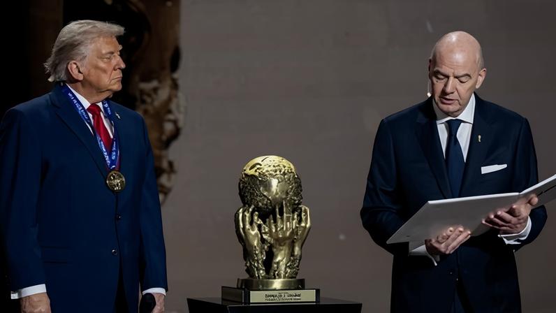 Donald Trump receives the Fifa peace prize from Fifa president Gianni Infantino during the draw for the 2026 World Cup in the US.