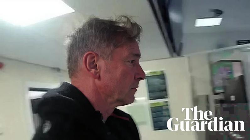 Paul Doyle being taken to a custody suite after his arrest.