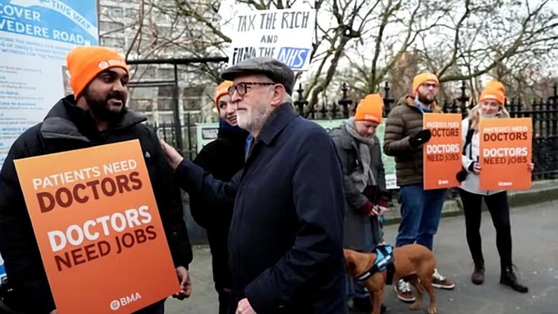 Jeremy Corbyn speaking with resident doctors on the picket line outside St Thomas' Hospital in London this morning. Photograph: Jonathan Brady/PA