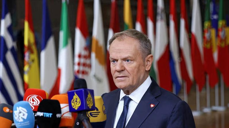 Polish Prime Minister Tusk speaks to the media during a European Union summit in Brussels