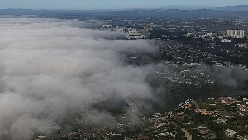 In an aerial view, fog envelopes the La Jolla coast on a fall day on Friday, in San Diego, California. Photograph: Kevin Carter/Getty Images