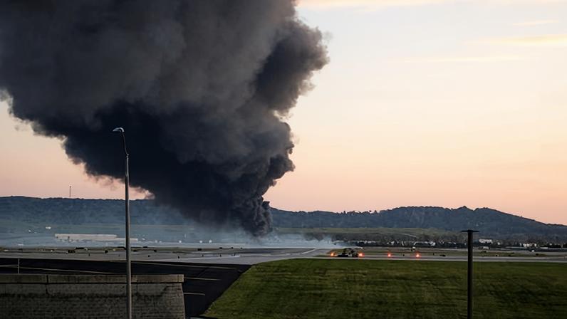Fire and smoke mark where a UPS cargo plane crashed near Louisville Muhammad Ali international airport on 4 November 2025 in Louisville, Kentucky.