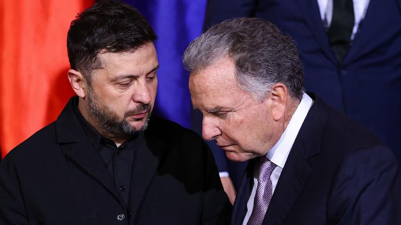 Ukraine's President Volodymyr Zelenskiy and U.S. Special Envoy Steve Witkoff speak as they gather for a family photo at the Chancellery in Berlin, Germany, December 15, 2025. REUTERS/Lisi Niesner/Pool/ File Photo