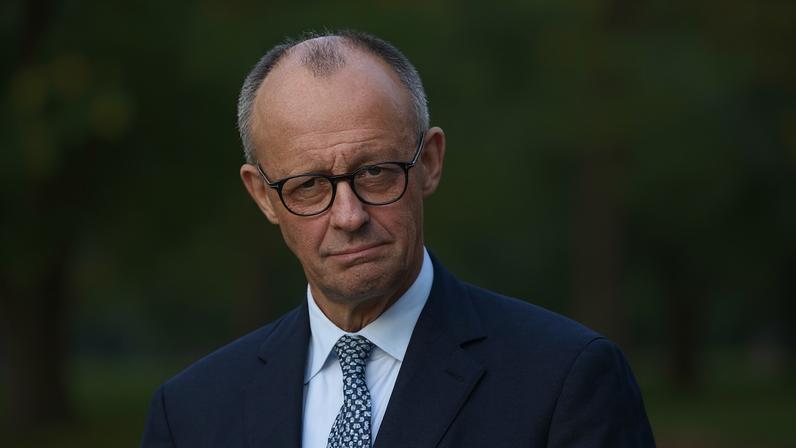 German Chancellor Friedrich Merz speaks to the media following a two-day government cabinet retreat at Villa Borsig on October 1, 2025 in Berlin.