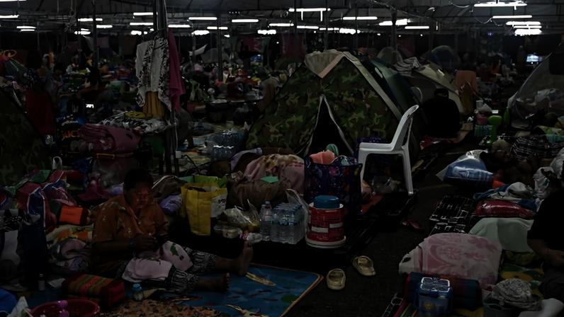 Displaced residents rest at an evacuation center at Chang International Circuit in the Thai border province of Buriram.