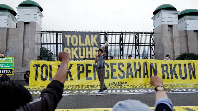 People protest against a new criminal code in Jakarta