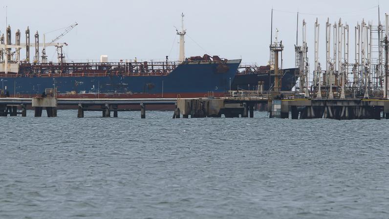 The Guinea-flagged oil tanker MT Bandra, which is under sanctions, is partially seen alongside another vessel at El Palito terminal, near Puerto Cabello, Venezuela December 29, 2025. REUTERS/Juan Carlos Hernandez