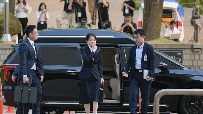South Korea's former first lady Kim Keon Hee arrives at a court to attend a hearing to review her arrest warrant, in Seoul