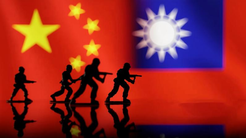 Solider miniatures are seen in front of displayed Chinese and Taiwanese flags in this illustration taken, April 11, 2023. REUTERS/Dado Ruvic/Illustration