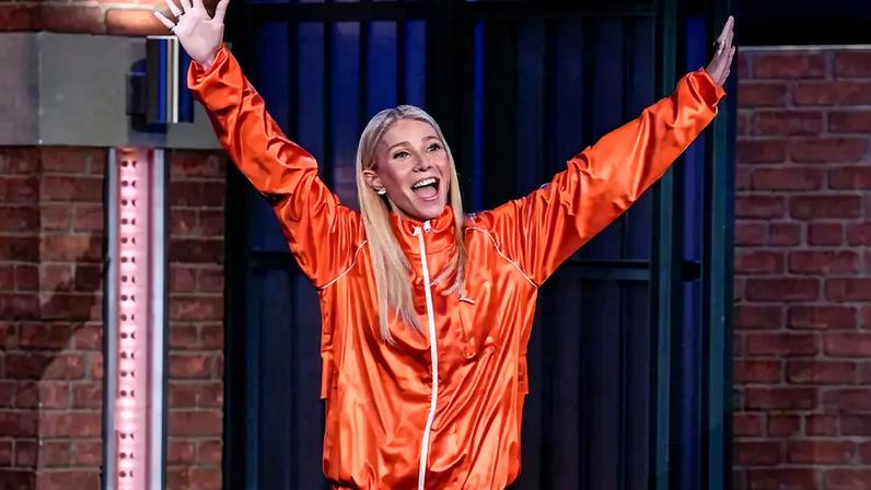 Gwyneth Paltrow wore a bright orange Lacoste track suit for an appearance on “Late Night with Seth Meyers.” Lloyd Bishop/NBC via Getty Images