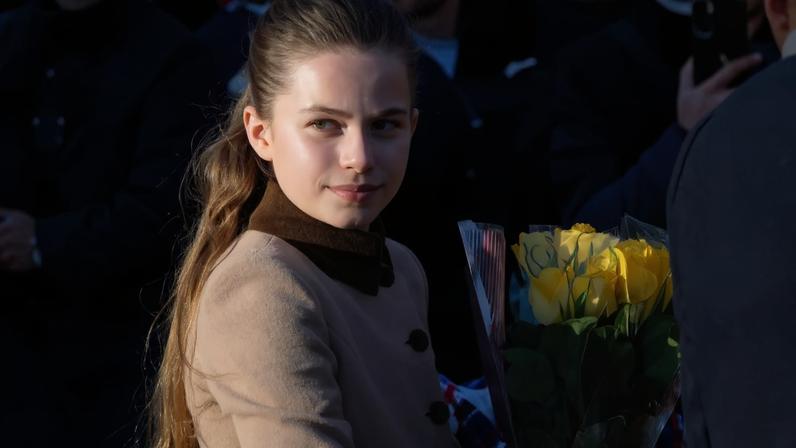 Princess Charlotte posed for several fan selfies during her family’s Christmas Day walk — forcing dad Prince William to hurry her along.