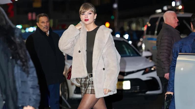 Taylor Swift paired an Agolde bodysuit with a Max Mara teddy coat, pleated Miu Miu miniskirt and Louis Vuitton boots in NYC Wednesday. GC Images