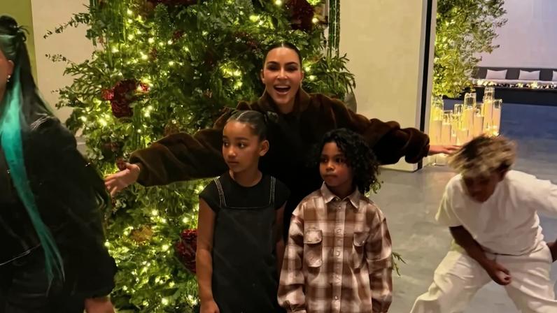 Kim Kardashian attempted to wrangle her four kids into a family Christmas photo on Monday.