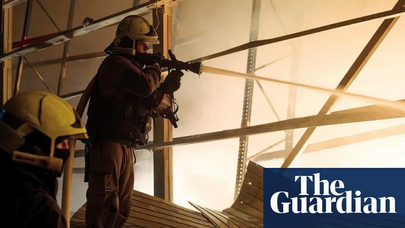 Firefighters work at an industrial facility hit in an overnight Russian drone strike in Odesa, southern Ukraine, on Thursday.