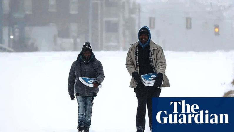 People walk through snow in Memphis, Tennessee, on 24 January 2026.