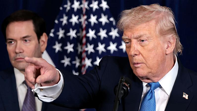 U.S. President Donald Trump points as U.S. Secretary of State Marco Rubio looks on during a press conference following a U.S. strike on Venezuela where President Nicolas Maduro and his wife Cilia Flores were captured, from Trump's Mar-a-Lago club in Palm Beach, Florida, U.S., January 3, 2026. REUTERS/Jonathan Ernst