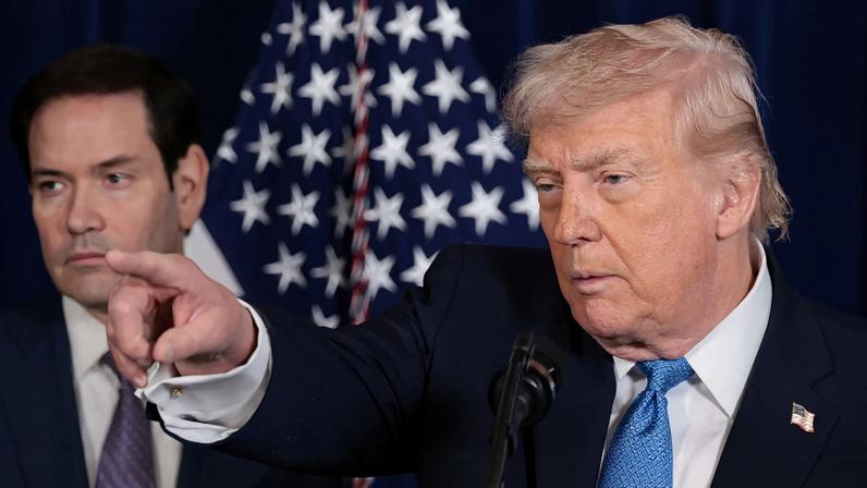 U.S. President Donald Trump points as U.S. Secretary of State Marco Rubio looks on during a press conference following a U.S. strike on Venezuela where President Nicolas Maduro and his wife, Cilia Flores, were captured, from Trump's Mar-a-Lago club in Palm Beach, Florida, U.S., January 3, 2026. REUTERS/Jonathan Ernst