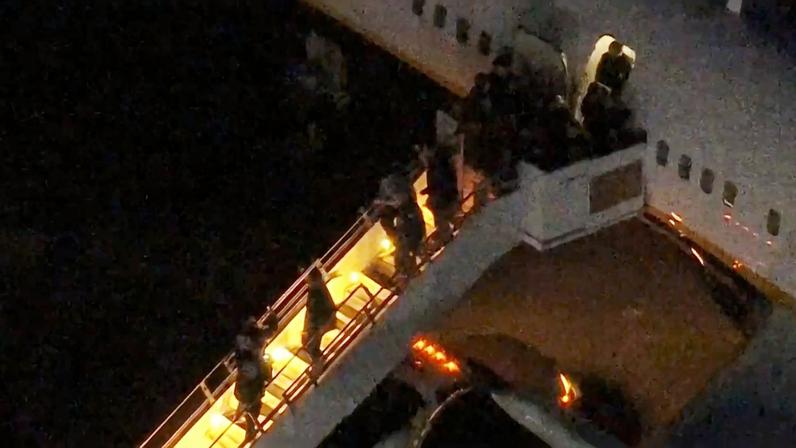 Venezuela's President Nicolas Maduro is led in custody from a U.S. federal airplane before his scheduled court appearance at Manhattan federal court, at Stewart Air National Guard Base in Newburgh, New York, U.S. January 3, 2026. ABC Affiliate WABC via REUTERS NO RESALES. NO ARCHIVES. THIS IMAGE HAS BEEN SUPPLIED BY A THIRD PARTY. MANDATORY CREDIT